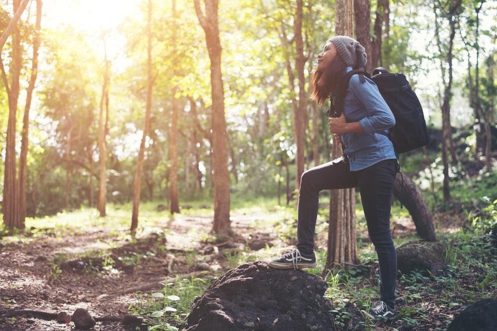 Woman hiking in woods