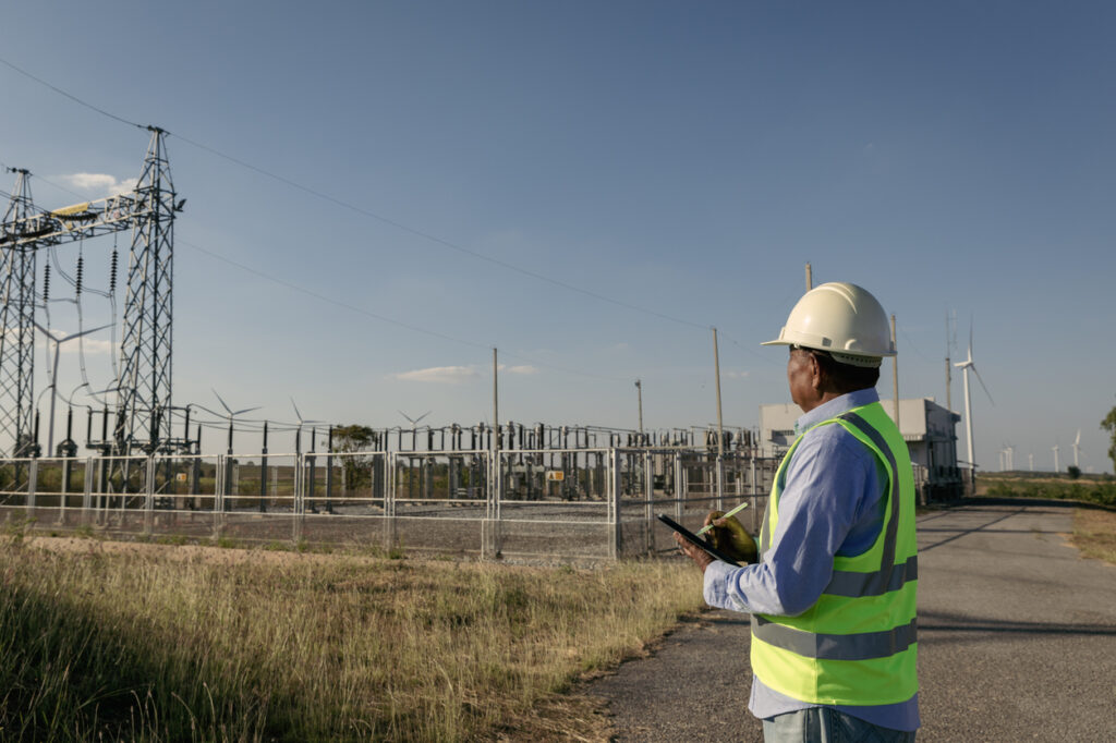 Credit: Pituk Loonhong inspecting power lines - help break the wildfire-grid-drought cycle