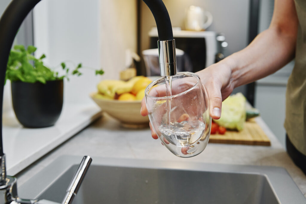 Credit: Lazy_Bear Pouring water from kitchen sink - why you should test for PFAS