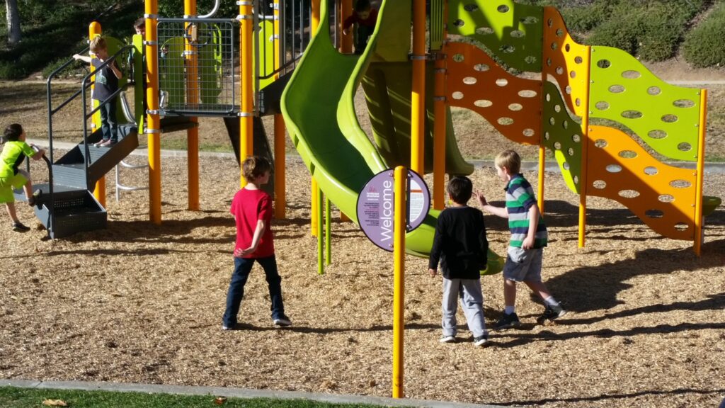 Image property of Tara McFatridge - Biofriendly Planet Magazine Children playing at playground